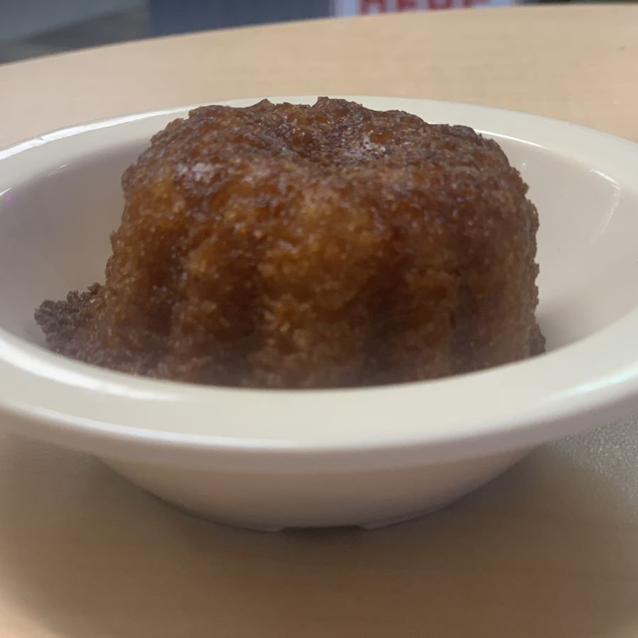 A warm glazed mini loaf in a bowl